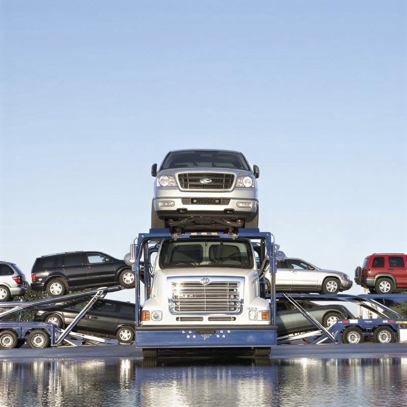 A car loaded onto an open carrier for shipping out of Washington, DC